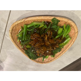 Chinese broccoli straw mushroom over rice